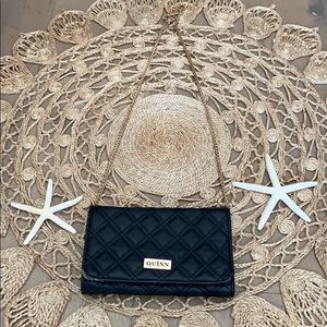 Casual purse with golden chain strap.